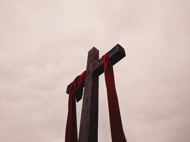 cross with red cloth around it