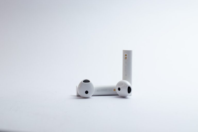 airpods on an off white background